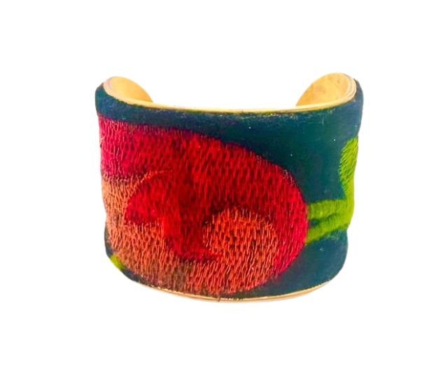The 2-inch France cuff bracelet features intricate velvet embroidery with bold floral designs in pink, red, and green. Handcrafted on a sturdy vintage brass base by Redd Dott Jewelry.