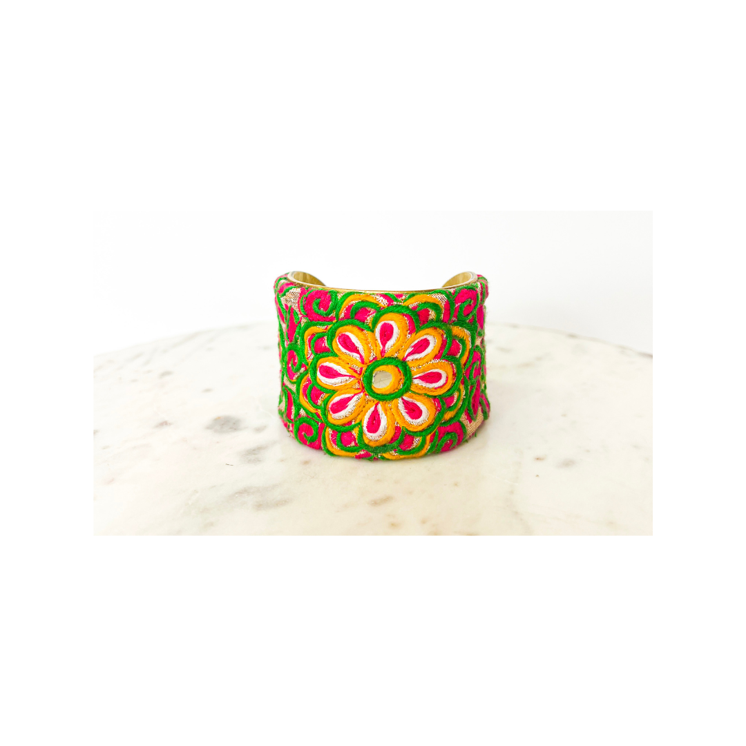 Vibrant handmade embroidered floral cuff bracelet featuring fuchsia, orange, and yellow blooms on brass — handcrafted in Shreveport, LA by Redd Dott Jewelry.