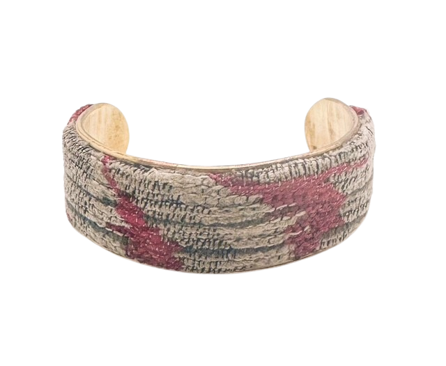 1-inch brass cuff bracelet featuring red and neutral embroidery, handmade in Shreveport, LA, with an optional personalized interior.