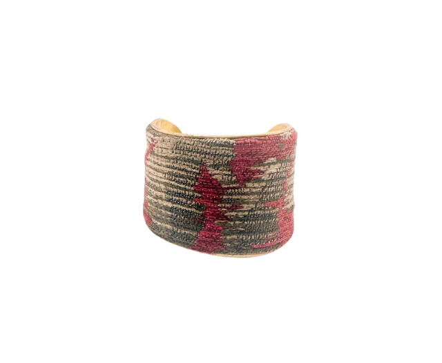 2-inch handmade brass cuff bracelet showcasing red and neutral embroidery, crafted by Redd Dott Jewelry in Shreveport, LA, with an optional interior customization.