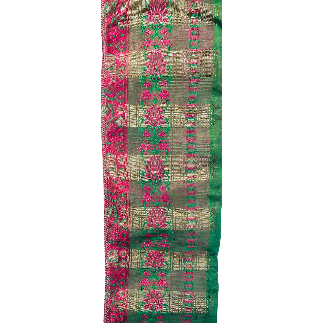 A Vintage Cuff Bracelet by Redd Dott Jewelry, featuring an ornate blend of emerald green, magenta, and gold in intricate floral and geometric patterns.