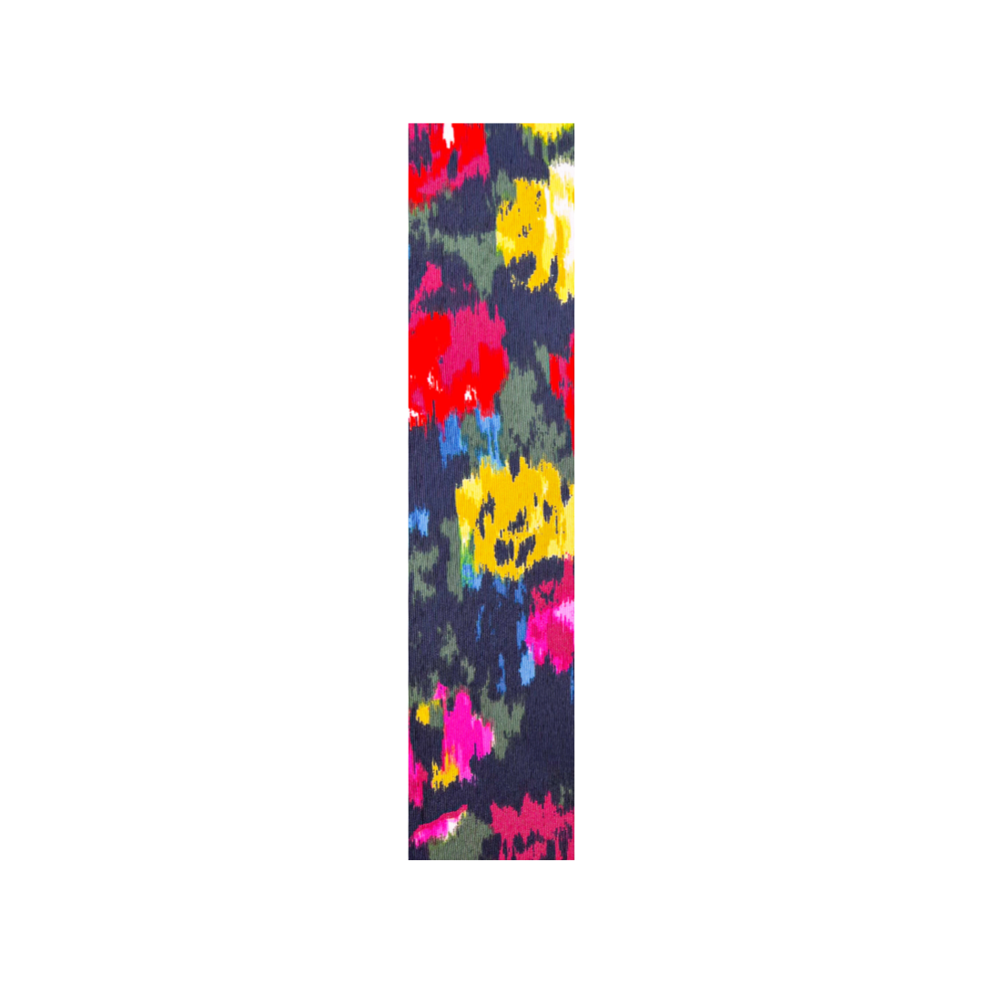Abstract multicolor fabric with vibrant red, pink, yellow, and blue floral patterns used in the Aura Custom Stamped Brass Cuff Bracelet — handcrafted in Shreveport, LA by Redd Dott Jewelry.