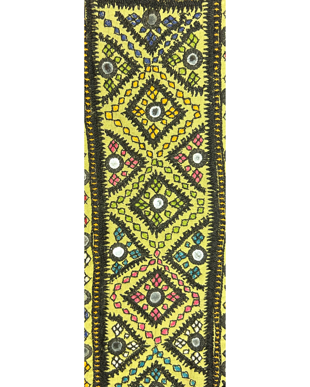 A handcrafted custom stamped cuff bracelet by Redd Dott Jewelry featuring embroidered vintage kaftan fabric with diamond motifs and mirrored accents. A colorful and bold vintage brass bracelet.