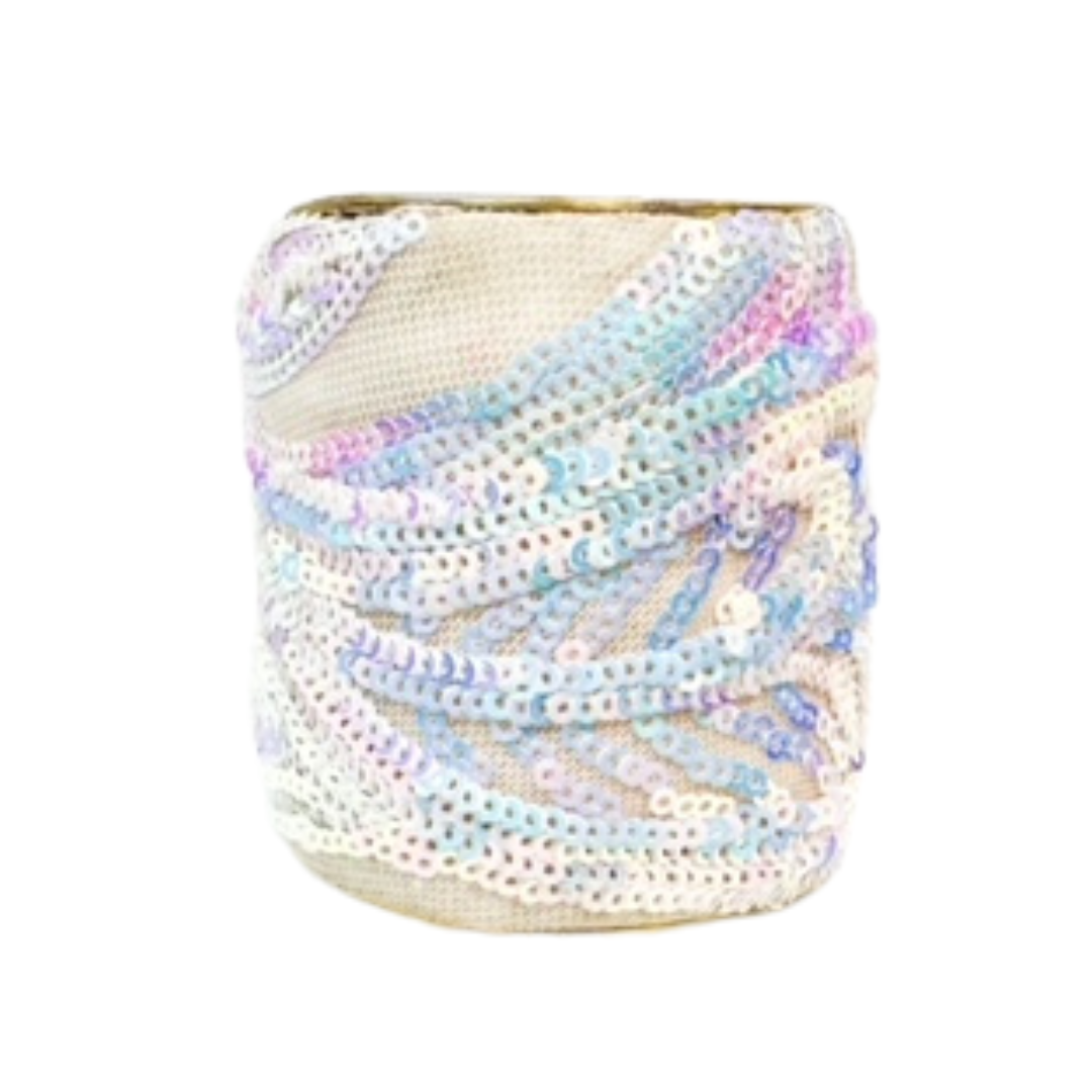 A 3-inch wide raw brass cuff bracelet wrapped in ivory mesh and hand-stitched with pastel iridescent sequins in fluid wave shapes. This statement brass cuff bracelet is one of a kind jewelry and perfect for women seeking bold cuff bracelets for women.