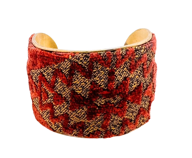 2-inch handmade brass cuff bracelet from Redd Dott Jewelry featuring bold red and gold geometric embroidery, crafted in Shreveport, LA, with an optional personalized interior.