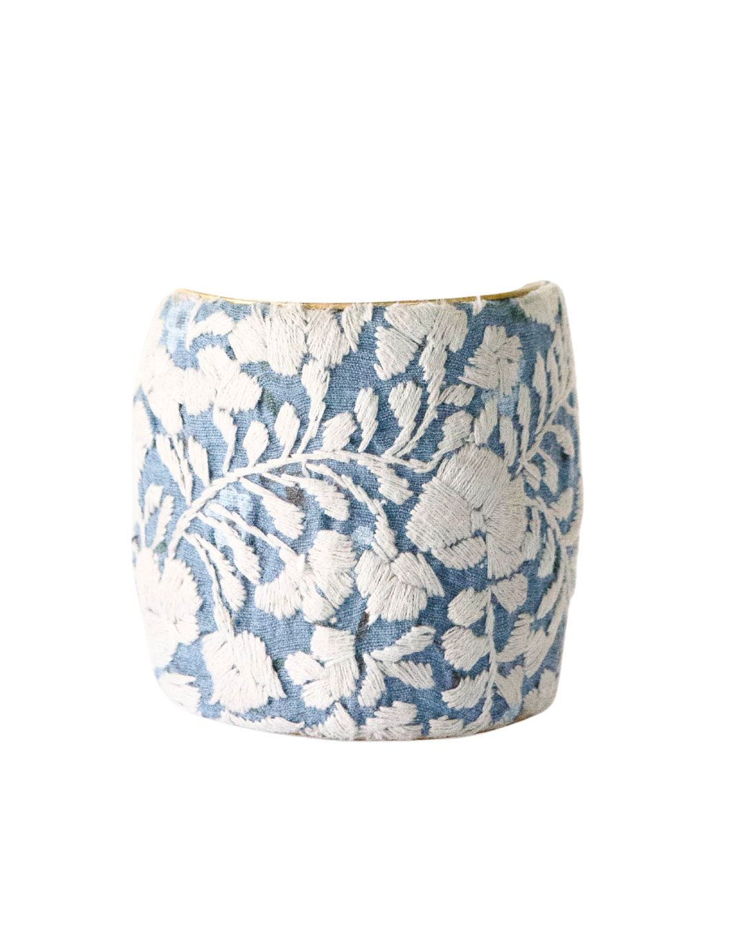 Three-inch Cielo Gris embroidered brass cuff bracelet showcasing detailed ivory florals and soft blue texture.