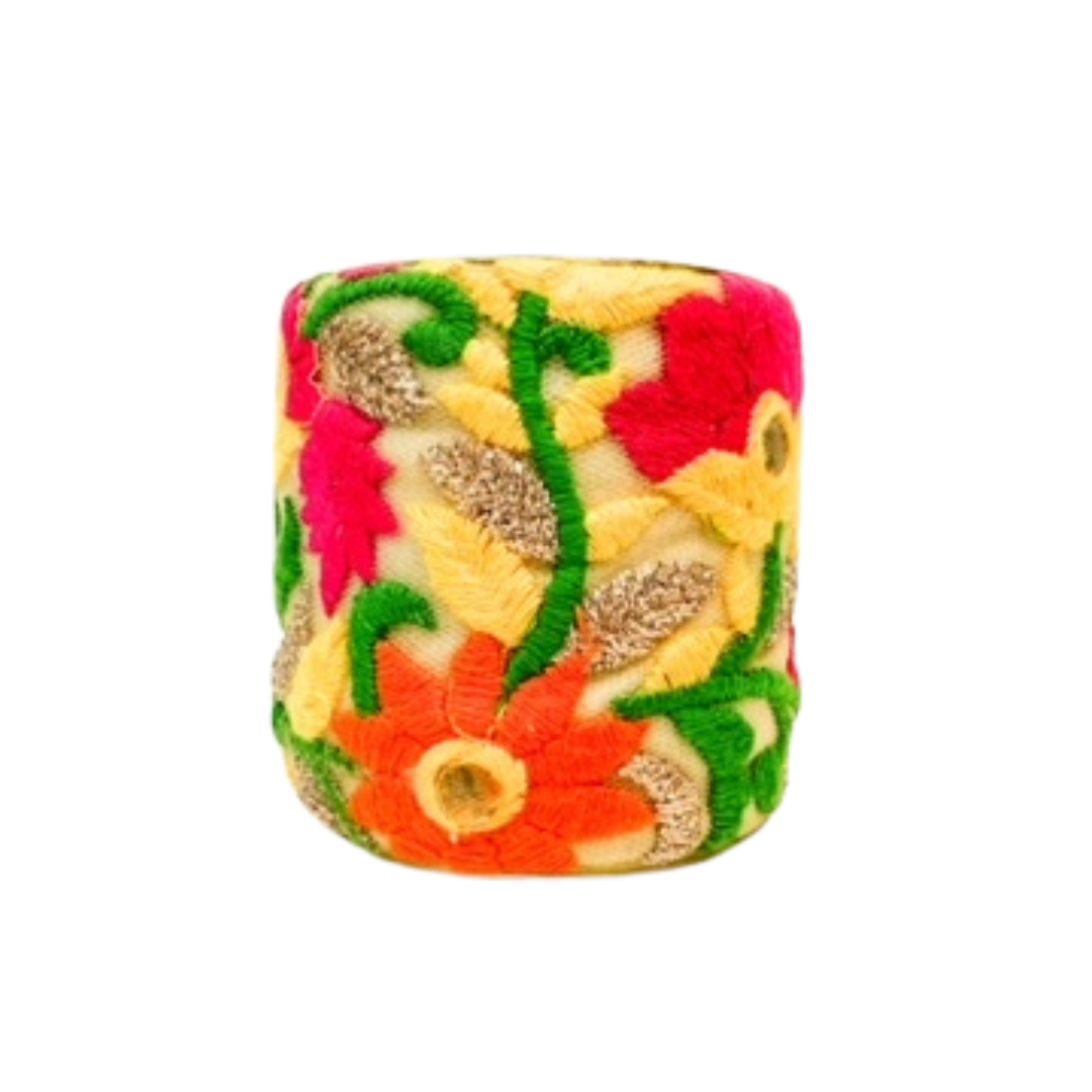 Clementine 3-inch statement cuff – bold embroidered blooms in red, yellow, and orange on beige fabric, handcrafted on a wide brass base.