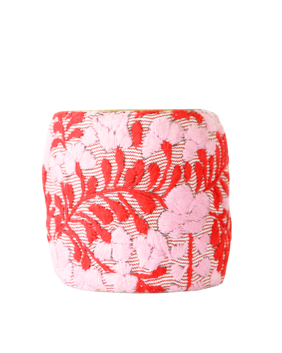 Three-inch Corazón Rojo embroidered brass cuff bracelet with detailed pink and red florals on soft striped textile.