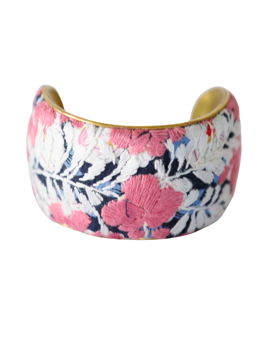 2-inch Flor De Alma embroidered brass cuff bracelet bursting with coral and pink flowers over deep navy blue textile.