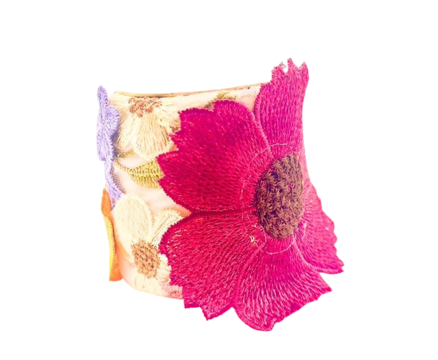 The Frenchie cuff bracelet in a 3-inch size, showcasing detailed floral embroidery in vivid tones of pink, purple, and cream on a sturdy brass base.