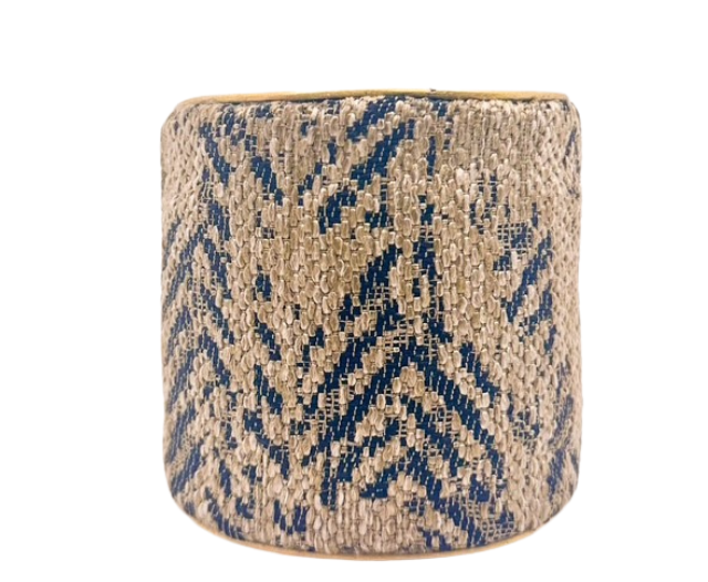 The Gianna Fabric Cuff Bracelet by Redd Dott Jewelry showcases a woven navy and beige herringbone fabric overlay on a vintage brass base.