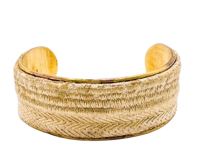 The Glad cuff bracelet by Redd Dott Jewelry features a woven gold-tone chevron pattern on a vintage brass base. Available in 1-inch and 2-inch sizes with a hand-stamped inspirational message inside.
