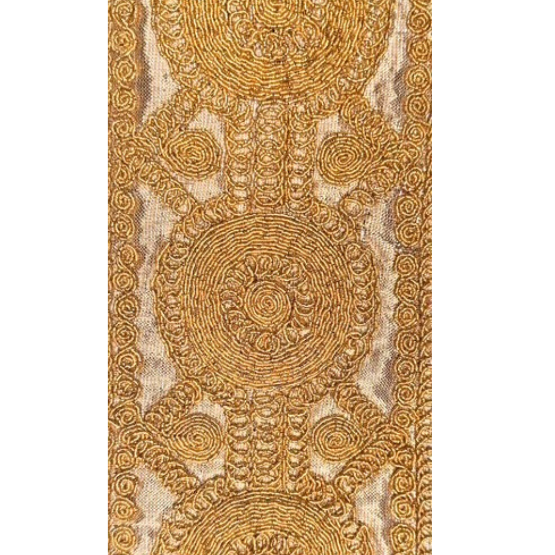 The Goldie cuff bracelet by Redd Dott Jewelry features intricate gold circular embroidery on a vintage brass base.