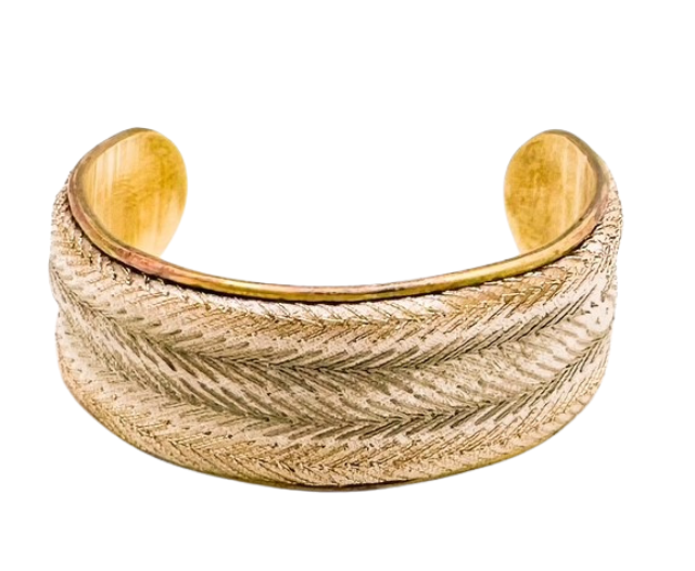 A handcrafted Glad cuff bracelet by Redd Dott Jewelry, showcasing a gold-tone chevron design on a brass base. Offered in multiple sizes with a personalized message inside.