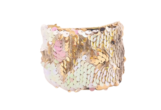 A handcrafted Let Them Eat Cake cuff bracelet by Redd Dott Jewelry, featuring shimmering gold sequins and a brass base. Offered in multiple sizes with a meaningful message inside.