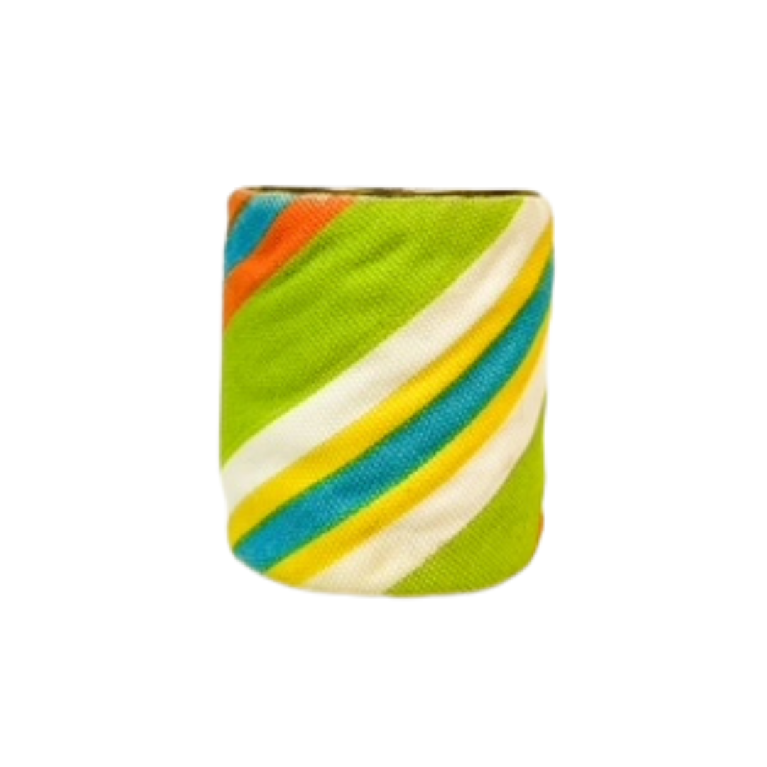 A 3-inch wide brass cuff bracelet wrapped in textured lime-green linen and accented with hand-stitched diagonal stripes of turquoise, yellow, orange, and white. This brass cuff bracelet is a one of a kind jewelry piece and a standout among cuff bracelets for women.