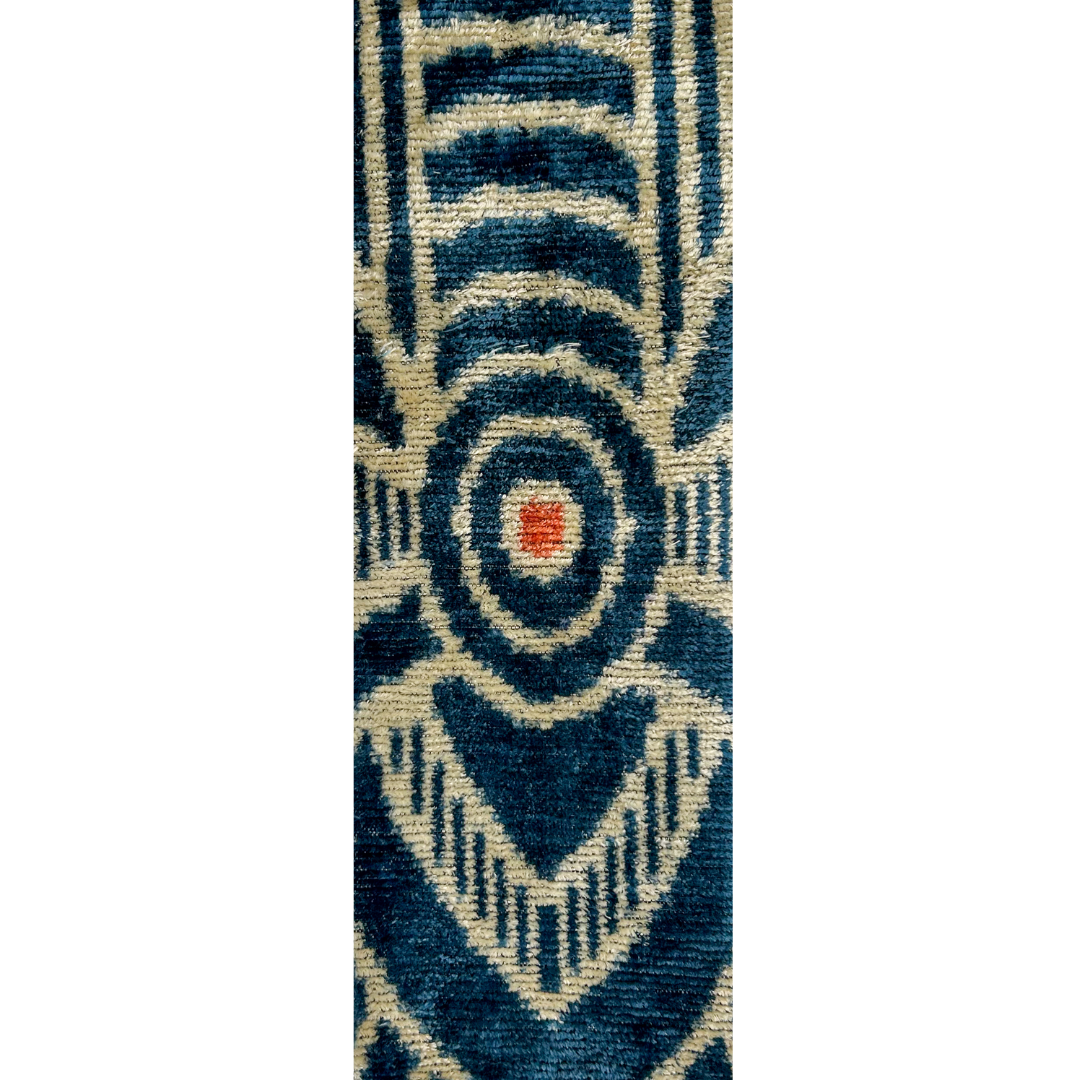 Close-up of Kenji custom stamped cuff bracelet fabric – vintage-inspired geometric pattern in indigo blue and warm beige with subtle rust red stitching, perfect for handmade brass cuff jewelry.