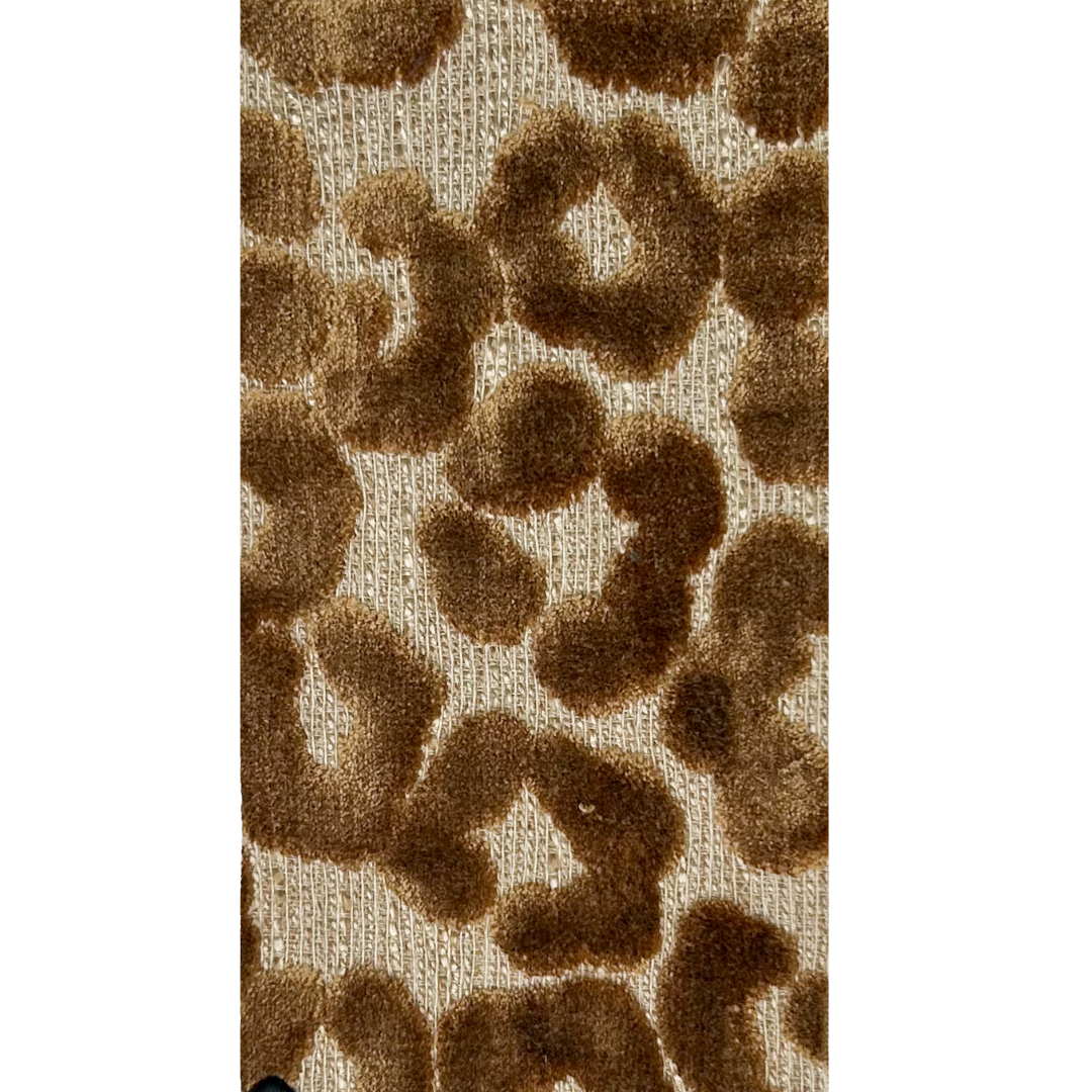 A nature-inspired jewelry piece by Redd Dott Jewelry, featuring a bold, textured leopard print in warm brown and beige tones
