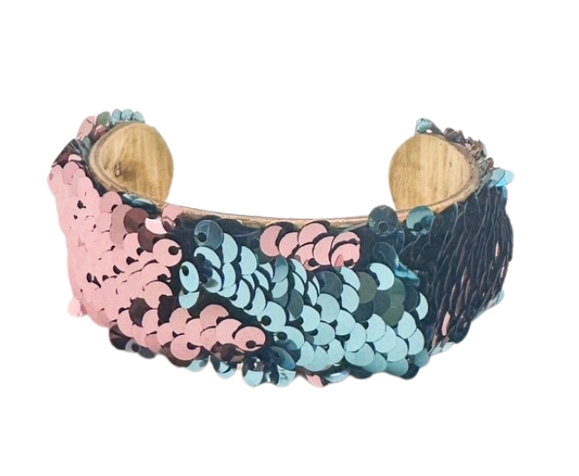 The Let the Good Times Roll cuff bracelet by Redd Dott Jewelry features pink and blue sequins on a vintage brass base. Available in 1-inch, 2-inch, and 3-inch sizes with a hand-stamped message inside.