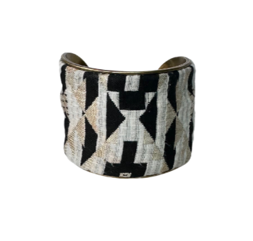 Geometric black and gold metallic vintage cuff bracelet featuring bold geometric patterns with a mix of black and metallic gold elements, offering a striking and timeless design.