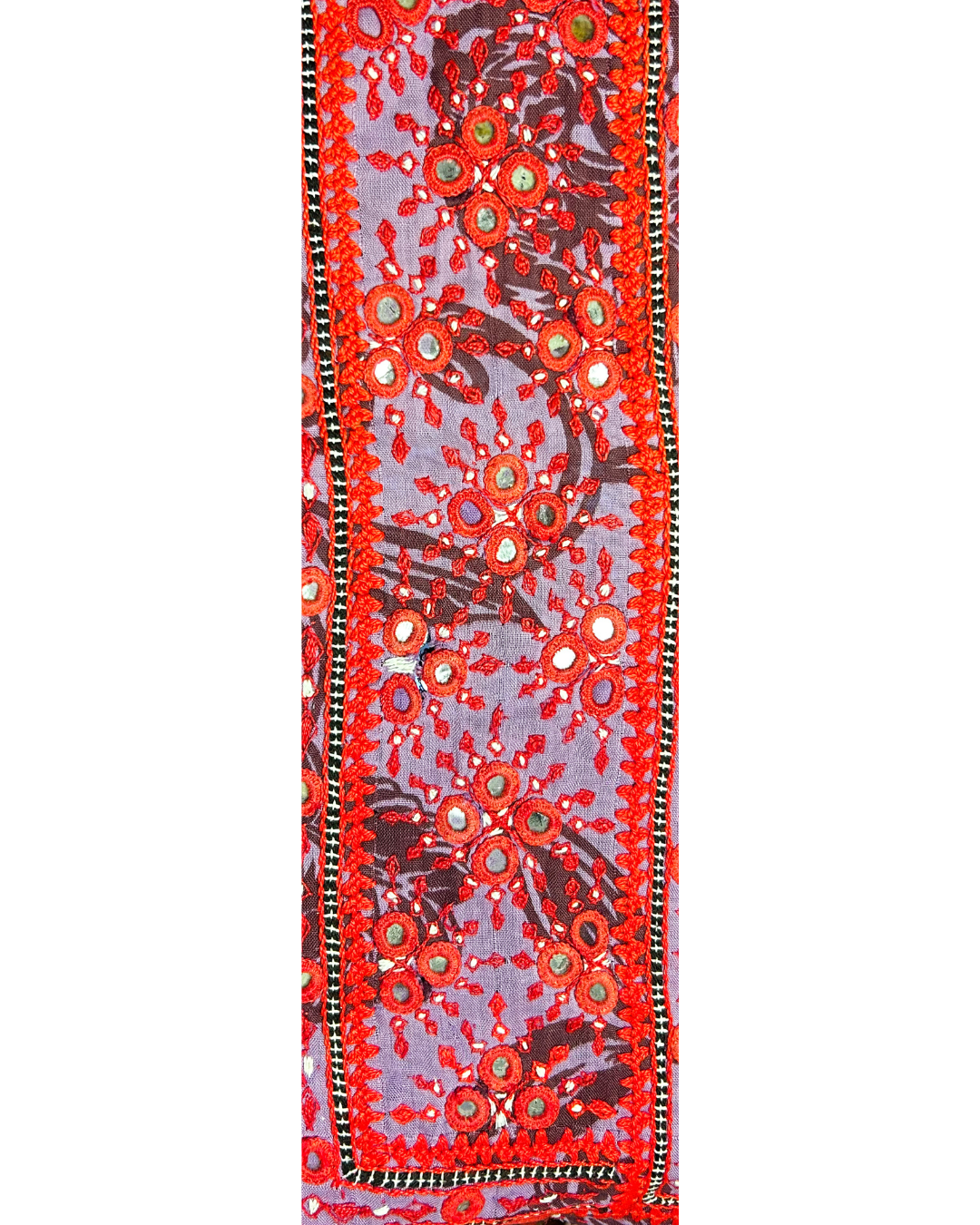 A handcrafted custom stamped cuff bracelet by Redd Dott Jewelry featuring red floral embroidery with mirrors on lavender fabric. A bold, textural vintage brass bracelet and dazzling piece of embroidered jewelry.