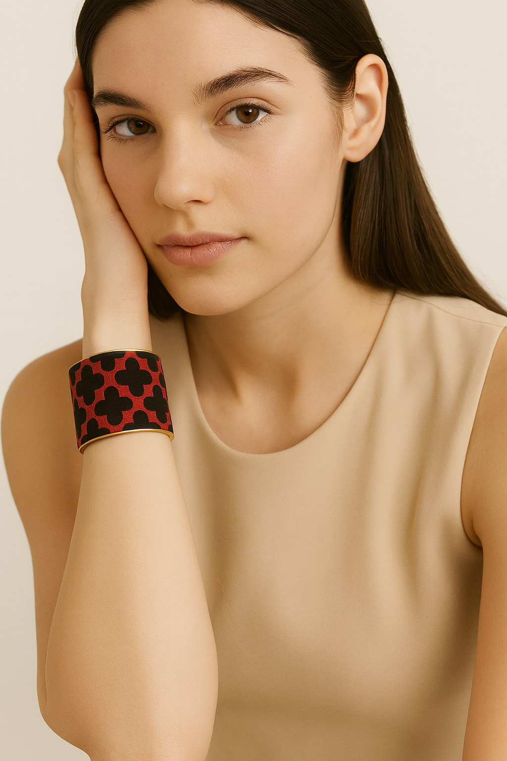 Redd Dott Arlet 2-inch cuff bracelet featuring bold black cross motifs over a deep red textile base, framed in brass for a striking modern edge.