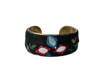 Blue and red floral mirrored cuff bracelet featuring intricate embroidery with vibrant red, blue, and white mirrored accents on a black background, creating a striking and colorful design.