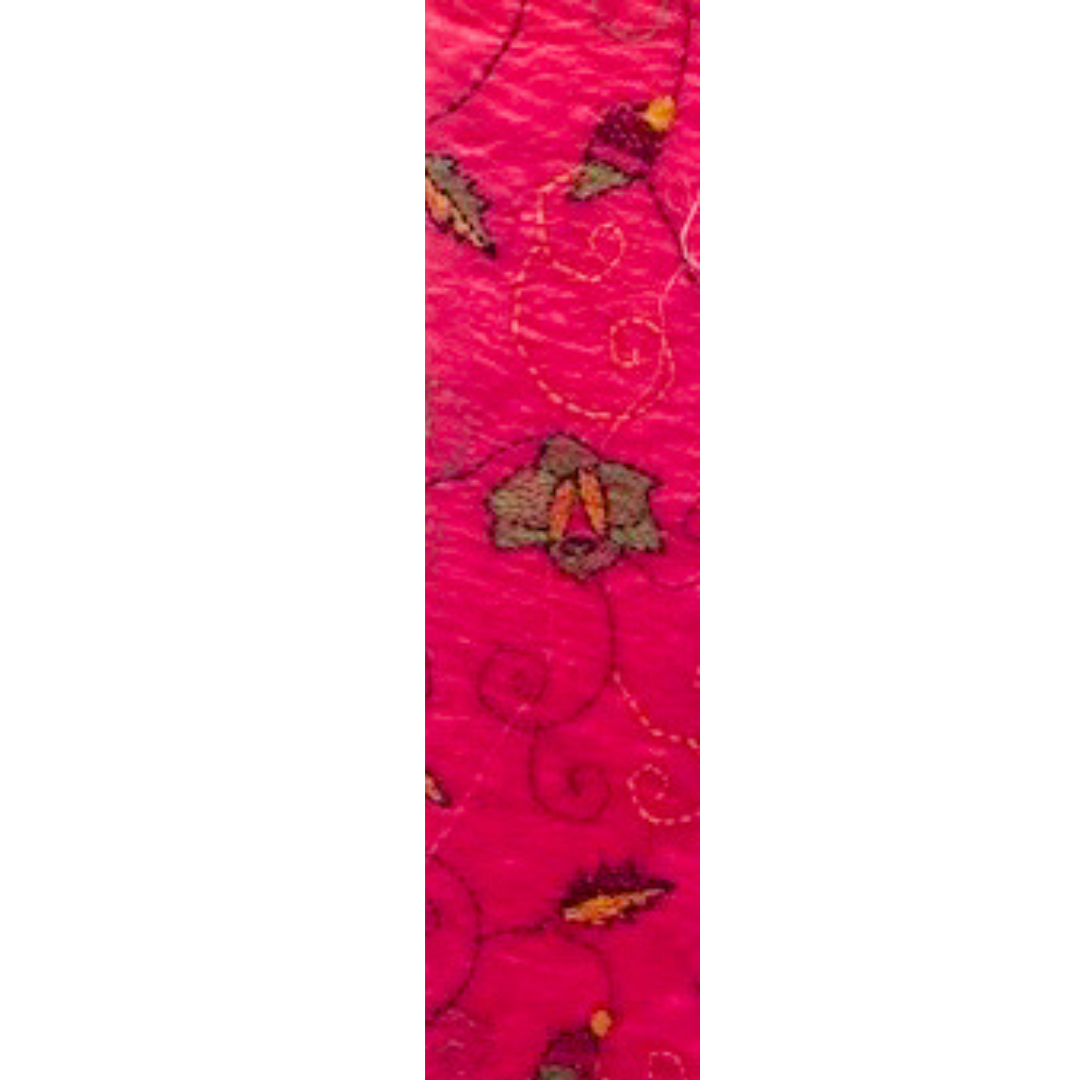 Hot pink bracelet with intricate floral embroidery, custom-stamped and handmade by Redd Dott Jewelry.