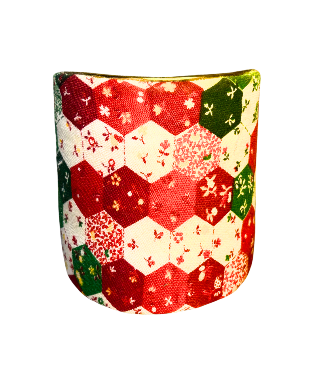 The Alam 3-inch brass cuff bracelet displays an expanded patchwork of red, green, and cream floral hexagons in a festive quilt pattern—designed as a bold holiday power bracelet and meaningful seasonal accessory.