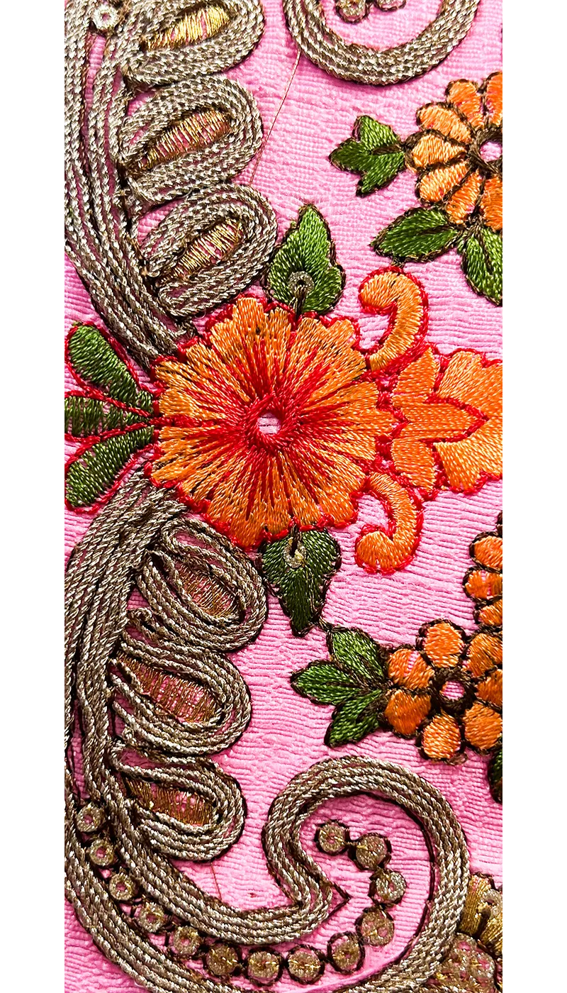 Close-up of Angelina Custom Cuff Bracelet showing coral and orange embroidered florals with gold-trimmed leaves on hot pink fabric, handcrafted in Shreveport, LA by Redd Dott Jewelry.