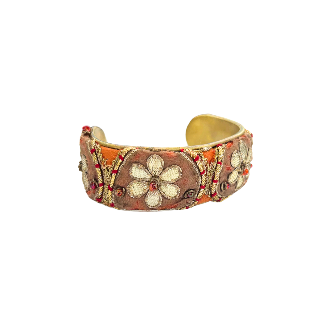 Clemence floral cuff bracelet – embroidered ivory flowers on sienna and copper vintage fabric with red accents, handcrafted on a brass base by Redd Dott Jewelry.