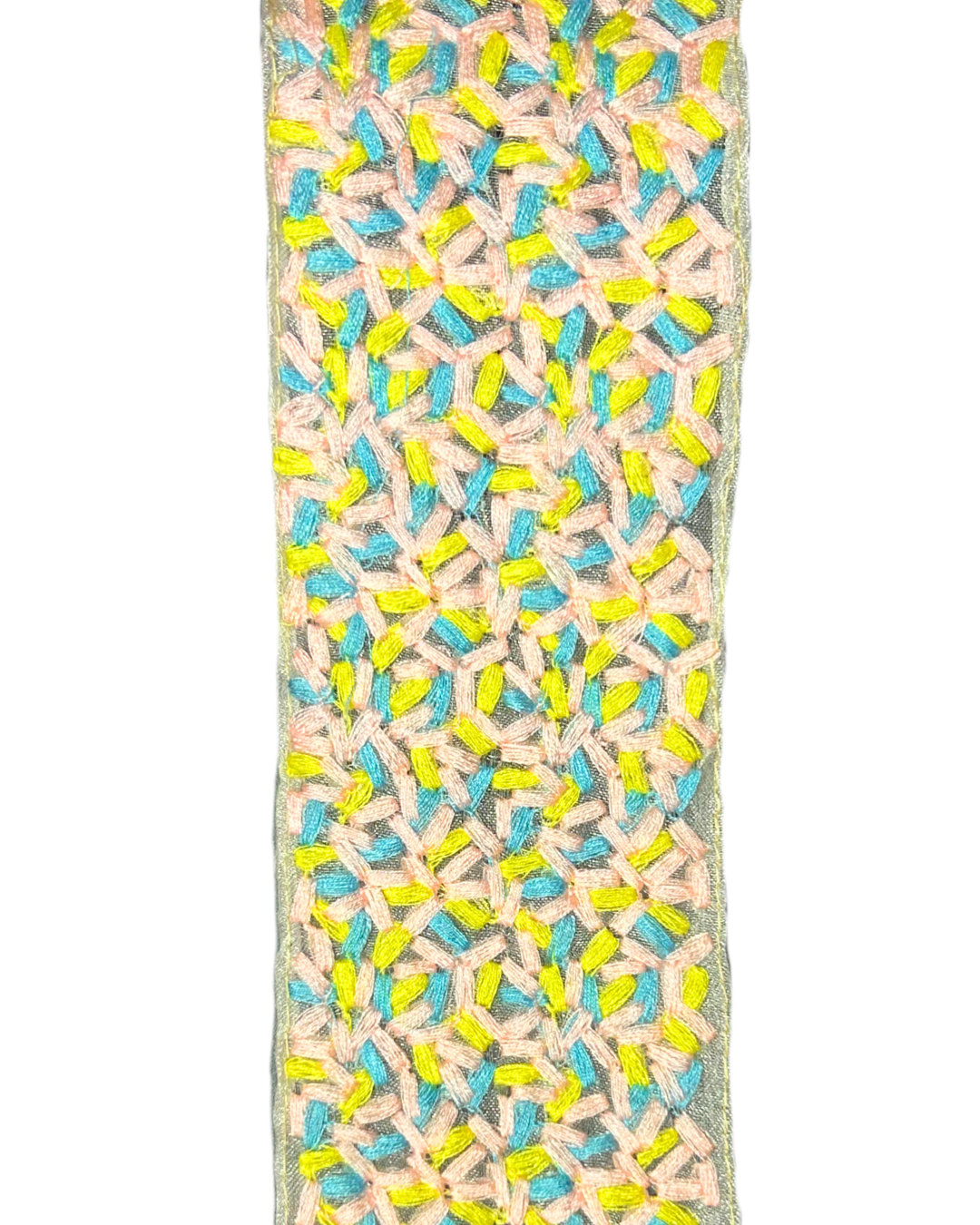 The Confetti custom cuff bracelet fabric features pastel pink, blue, and neon yellow embroidery in a geometric lattice pattern—perfect for embroidered jewelry with a stamped, personalized message on the brass interior.