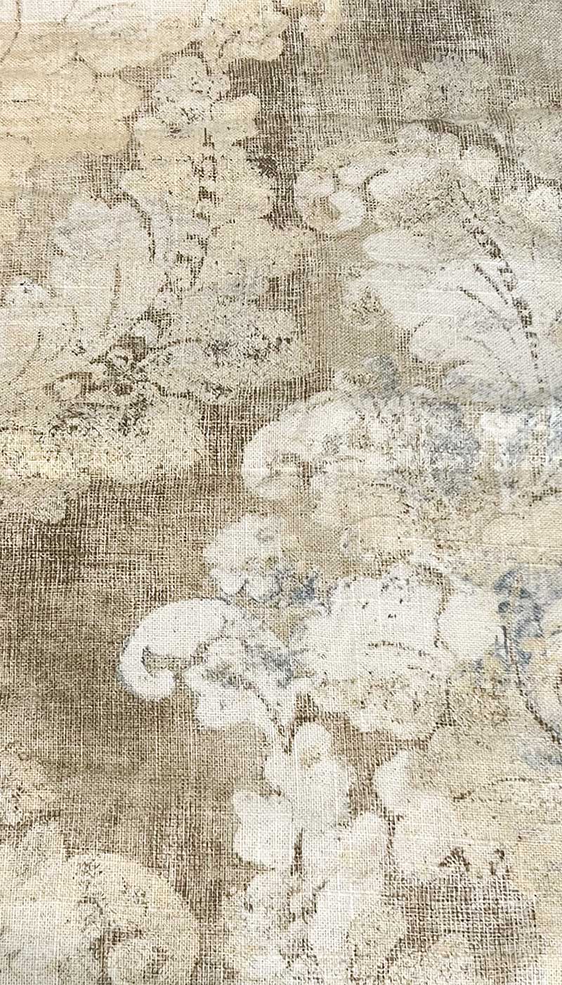 Close-up of neutral washed botanical fabric in ivory and beige used in the Cyra Brass Cuff Bracelet, featuring soft florals and textured detailing — handcrafted in Shreveport, LA by Redd Dott Jewelry.