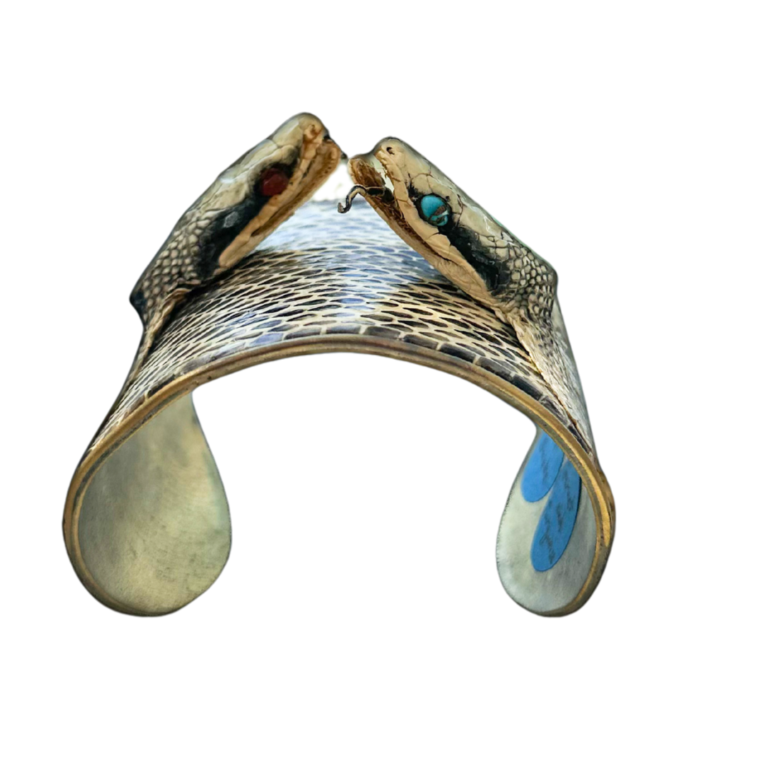 Front view of gold cuff bracelet with real preserved Texas rat snake heads, gemstone eyes, and natural scale pattern; handcrafted power bracelet from Redd Dott × The Wild Ones.