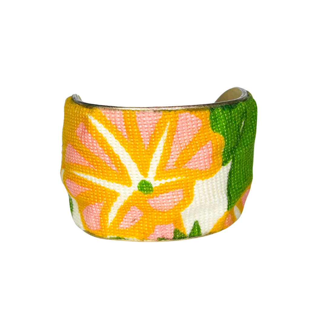 Helen 2-inch floral cuff bracelet – bold yellow and orange vintage flower print with green accents on a handcrafted brass base.
