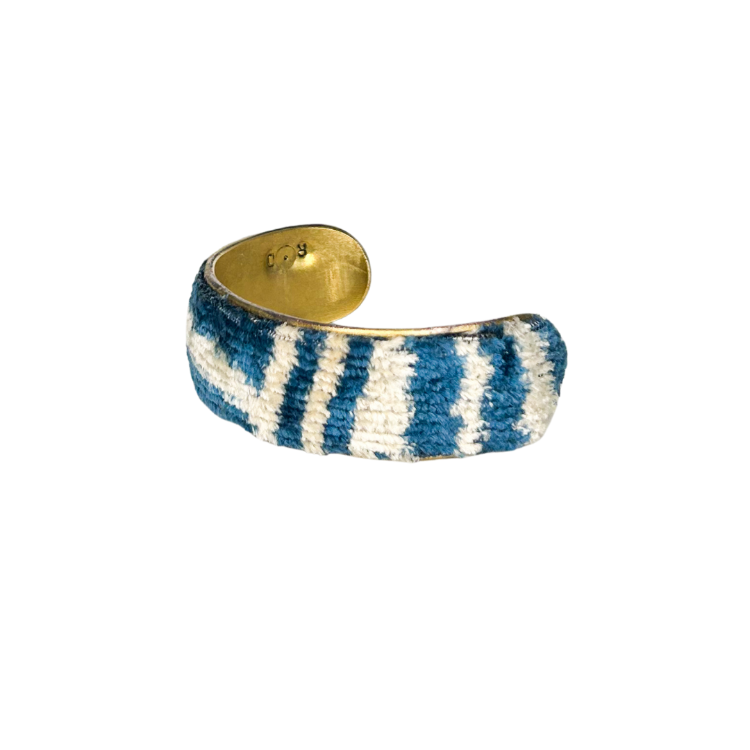 Kenji 1-inch textured cuff bracelet – deep indigo and ivory vintage fabric with abstract linear design on a slim brass cuff.