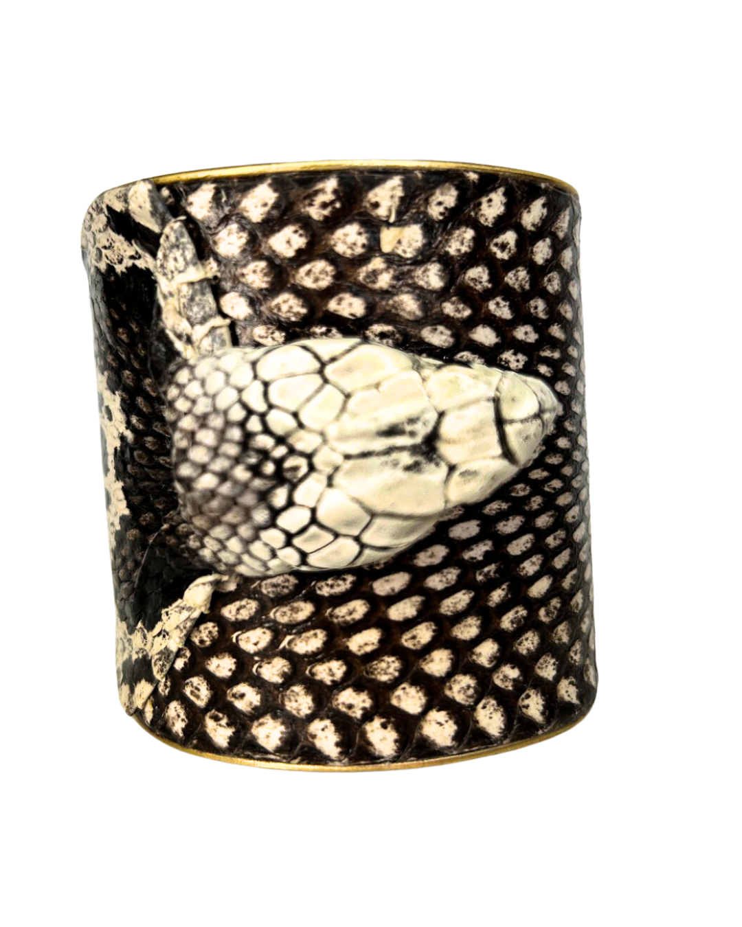 A striking Redd Dott Jewelry cuff featuring the preserved head of a genuine King Cobra snake skin. This unique piece of nature-inspired jewelry showcases the snake’s intricate scales and powerful design, making it a bold statement accessory.