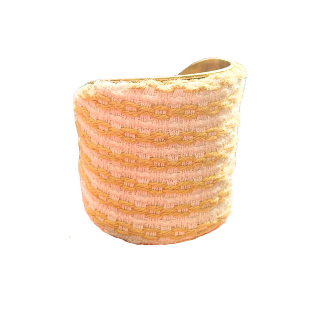 Kyleigh woven cuff bracelet – yellow and white linear embroidered textile wrapped around a wide brass base, handmade in Shreveport, Louisiana.