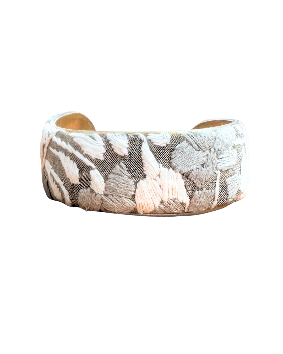 Soft gray embroidery meets hand-shaped brass in this elegant one of a kind cuff. Subtle, nature inspired jewelry that whispers strength and serenity.