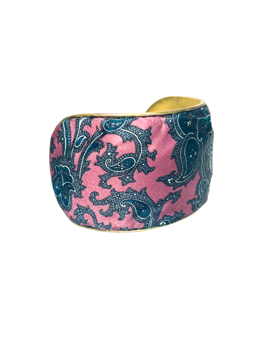A brass cuff bracelet with a vintage-inspired pink and blue paisley fabric overlay, handcrafted by Redd Dott Jewelry. The intricate swirling patterns and warm gold brass base create a timeless vintage bracelet look with an artistic, bohemian flair.