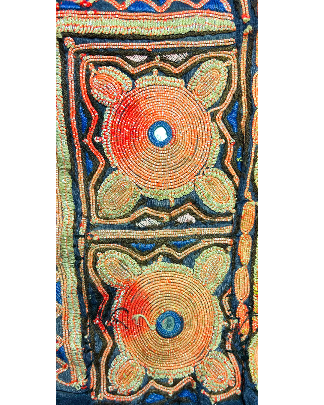 handmade custom stamped cuff from shreveport decorated with vivid textile designs in swirling circles and traditional motifs