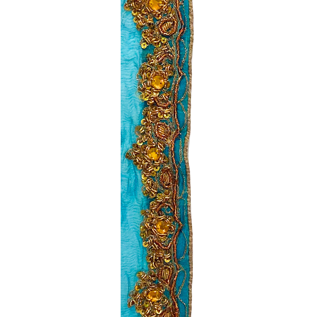 Gold cuff bracelet with turquoise fabric overlay and intricate golden embroidery, handmade by Redd Dott Jewelry.