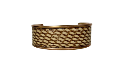A 1-Inch Handcrafted gold brass cuff bracelet with genuine preserved Eastern Brown snake skin featuring natural scale pattern and bronze-beige tones; nature inspired jewelry by Redd Dott Jewelry.