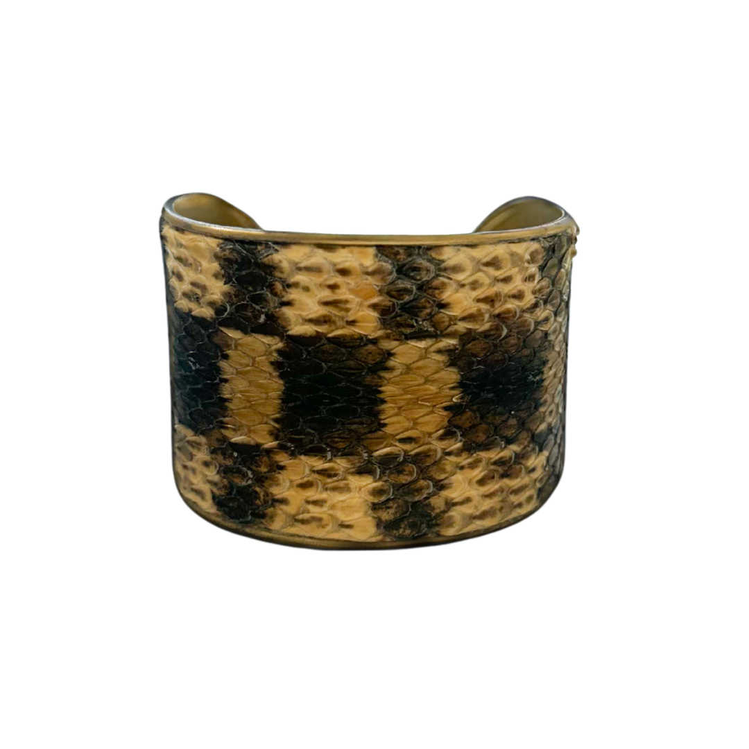 2-inch gold cuff bracelet handcrafted with genuine bull snake skin in natural golden tan and dark charcoal scale pattern; rustic statement jewelry by Redd Dott.