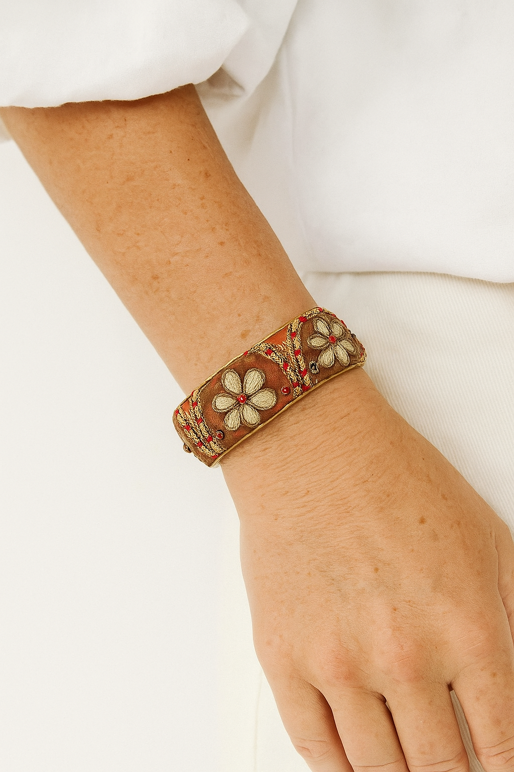 Clemence Custom Stamped Floral Cuff Bracelet – Orange Fabric with Blue Gem & Heart Embroidery