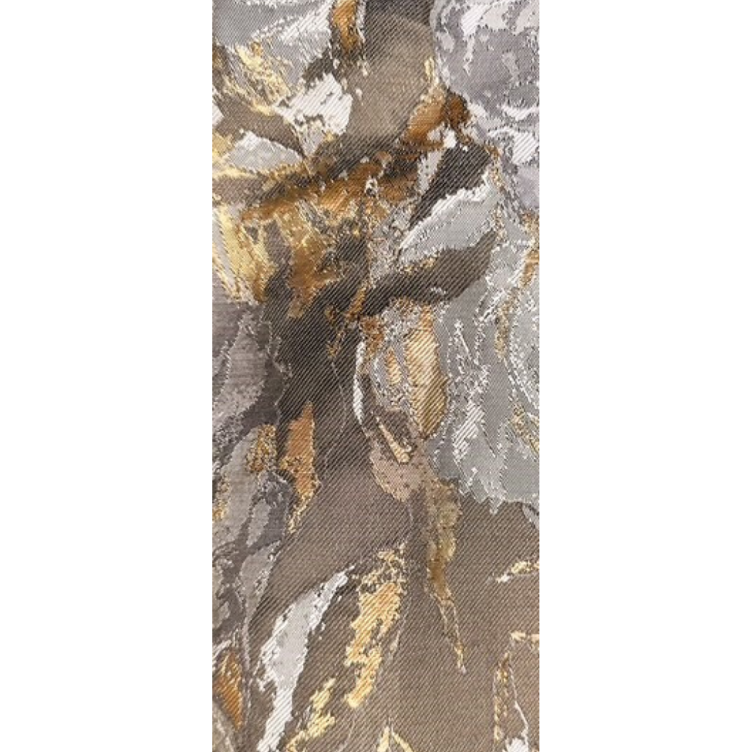 Close-up of fabric in distressed tones of black, grey, and gold used for the Abbi Hand Stamped Cuff Bracelet, featuring soft metallic texture and modern pattern, handcrafted in Shreveport, LA by Redd Dott Jewelry.