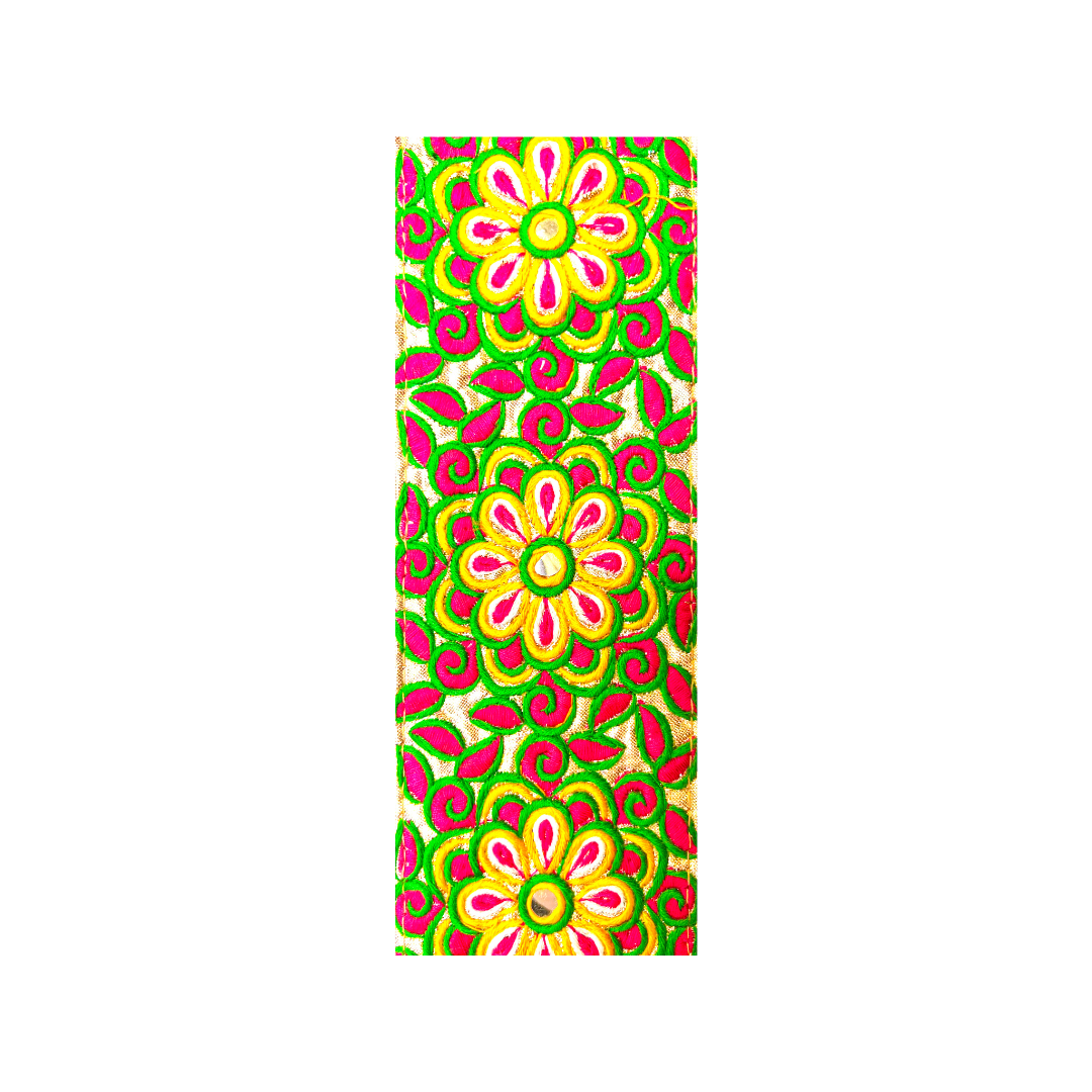 bright embroidered fabric with bold pink, yellow, and green floral patterns used for the Aurora Custom Brass Cuff Bracelet — handcrafted in Shreveport, LA by Redd Dott Jewelry.