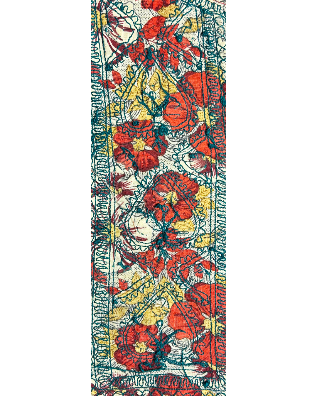 bold floral kaftan fabric in red, yellow, and teal on a luxury flower bracelet with hand-stamped brass accents.

