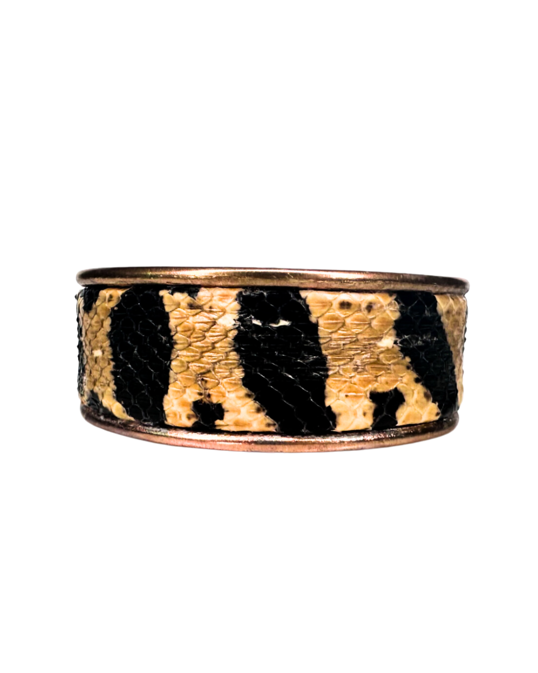 A handcrafted Redd Dott Jewelry cuff made from genuine Bull Snake skin, celebrating the essence of nature-inspired jewelry with its intricate scale patterns and rugged elegance. 