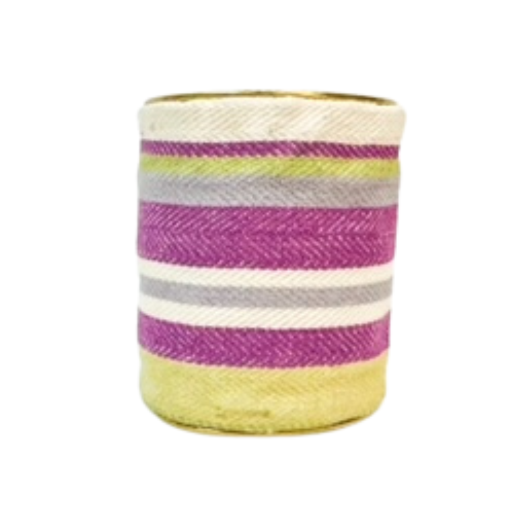 A studio image of a one of a kind jewelry brass cuff bracelet for women—a 3-inch wide, open-back design wrapped in handwoven diagonal-striped fabric of fuchsia, lime green, gray, and ivory, displayed on a white background.

